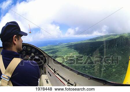 Hawaii, Maui, Yellow Glider Over Hana, View Of Pilot. View Large Photo Image Stock Photo - Hawaii, Maui, Yellow Glider Over Hana, View Of Pilot.. Fotosearch