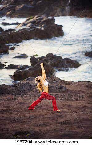 Hawaii, Maui, Young Woman Doing Yoga Next To The Ocean. View Large Photo Image Picture - Hawaii, Maui, Young Woman Doing Yoga Next To The Ocean.. Fotosearch