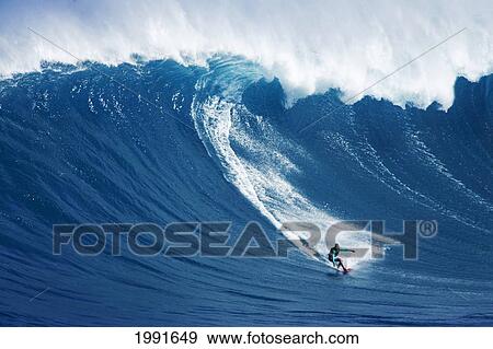 Stock Photo - Hawaii, Maui, Yuri Farrant Surfs Huge Wave At Jaws, Aka Peahi.. Fotosearch
