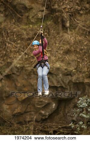 Hawaii, Maui, Zipline Adventure, Young Girl On The Line. View Large Photo Image Picture - Hawaii, Maui, Zipline Adventure, Young Girl On The Line.. Fotosearch