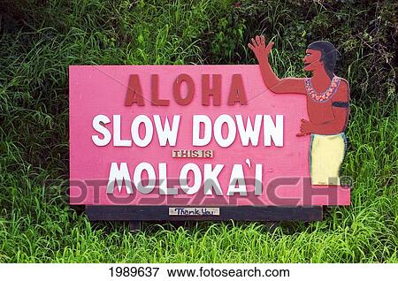 Stock Photo - Hawaii, Molokai, Hoolehua, Aloha - Slow Down Sign On Airport Road.. Fotosearch