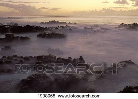 Hawaii, Molokai, Kau Poa Beach, Lava Rocks In Foggy Layer Over Pale Sunrise Water View Large Photo Image Stock Photo - Hawaii, Molokai, Kau Poa Beach, Lava Rocks In Foggy Layer Over Pale Sunrise Water. Fotosearch