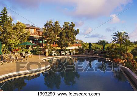 Stock Image - Hawaii, Molokai, Maunaloa, Molokai Ranch Lodge, Swimming Pool And Lodge. Fotosearch