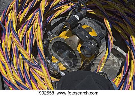 Stock Photo - Hawaii, Oahu, A Commercial Divers Hard Hat Helmet And Suface Supply Hoses.. Fotosearch