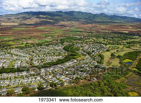Hawaii, Oahu, Aerial Of Ewa Plains Area, New Housing Developments And Agricultural Land Reaching Towards Waianae Range. View Large Photo Image Stock Image - Hawaii, Oahu, Aerial Of Ewa Plains Area, New Housing Developments And Agricultural Land Reaching Towards Waianae Range.. Fotosearch