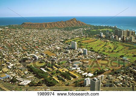 Picture - Hawaii, Oahu, Aerial View Of Neighborhoods Surrounding Diamond Head, Blue Sky. Fotosearch
