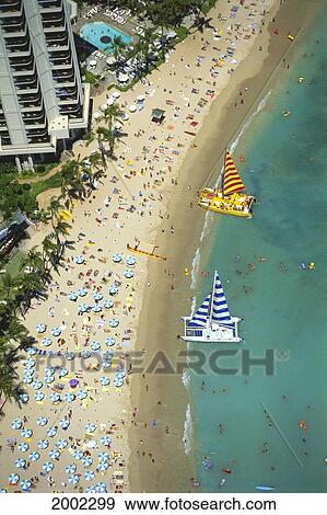 Stock Photo - Hawaii, Oahu, Aerial View Of Waikiki Beach And Sailboats, Crowded Beach. Fotosearch