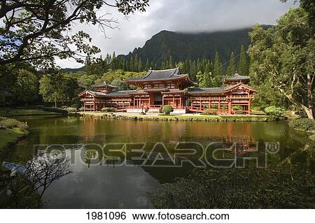 Stock Photograph - Hawaii, Oahu, Ahuimanu Valley, Valley Of The Temples, Byodo-In Temple Surrounded By Trees.. Fotosearch