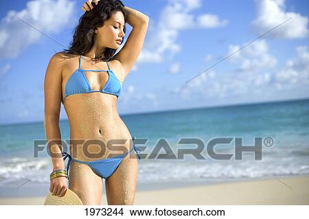 Picture - Hawaii, Oahu, Attractive Young Woman On The Beach.. Fotosearch