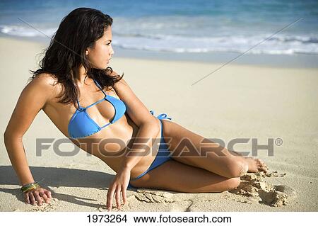 Picture - Hawaii, Oahu, Attractive Young Woman On The Beach.. Fotosearch