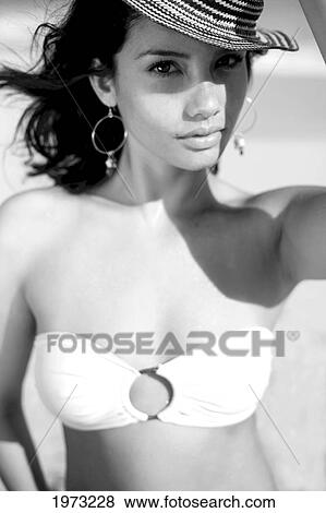 Stock Photo - Hawaii, Oahu, Attractive Young Woman On The Beach.. Fotosearch