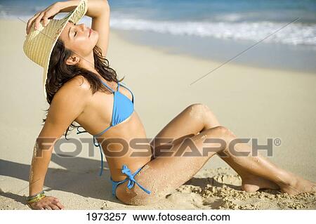 Stock Photo - Hawaii, Oahu, Attractive Young Woman On The Beach.. Fotosearch