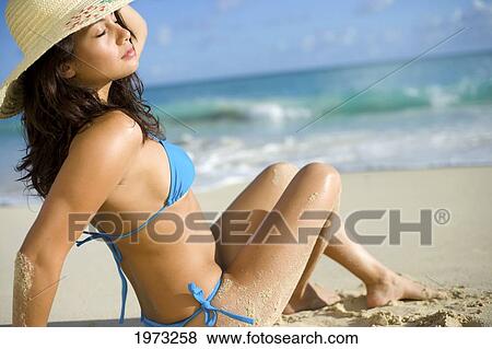 Stock Photo - Hawaii, Oahu, Attractive Young Woman On The Beach.. Fotosearch