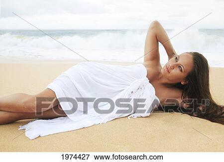 Stock Photo - Hawaii, Oahu, Attractive Young Woman On The Beach.. Fotosearch