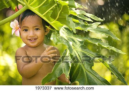 Stock Photo - Hawaii, Oahu, Baby Girl Playing With Water.. Fotosearch