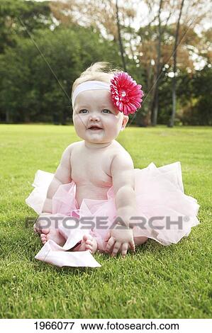 Hawaii, Oahu, Baby Girl Sits In Grass Wearing A Pink Tutu And Flower. View Large Photo Image Stock Photo - Hawaii, Oahu, Baby Girl Sits In Grass Wearing A Pink Tutu And Flower.. Fotosearch