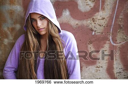 Stock Photograph - Hawaii, Oahu, Beautiful Headshot Of A Exotic Woman Wearing A Lavendar Hoodie.. Fotosearch