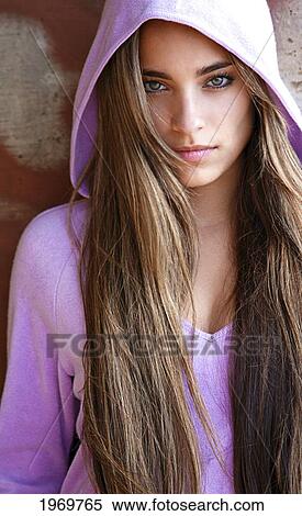 Stock Photography - Hawaii, Oahu, Beautiful Headshot Of A Exotic Woman Wearing A Lavendar Hoodie.. Fotosearch