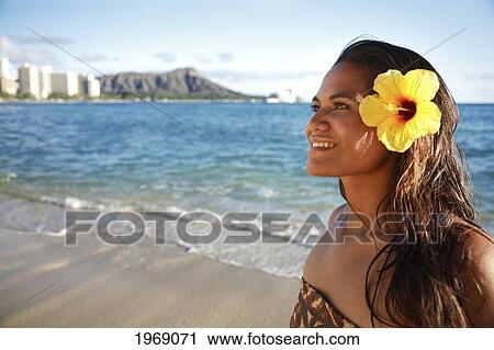 Stock Image - Hawaii, Oahu, Beautiful Local Polynesian Female Smiling On Waikiki Beach With Diamond Head In Background. Fotosearch