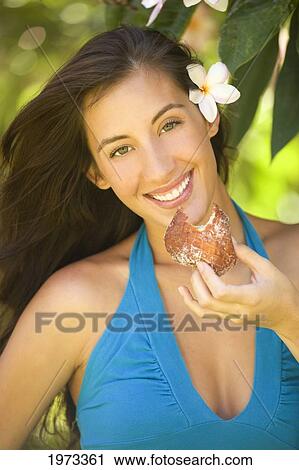 Hawaii, Oahu, Beautiful Model Eating A Malasadas (Local Cuisine). View Large Photo Image Stock Image - Hawaii, Oahu, Beautiful Model Eating A Malasadas (Local Cuisine).. Fotosearch