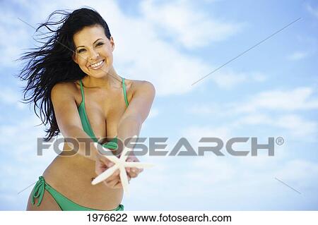 Stock Image - Hawaii, Oahu, Beautiful Woman Posing On The Beach.. Fotosearch