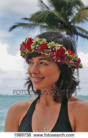 Hawaii, Oahu, Beautiful Woman Wearing Haku Lei By The Ocean Looks To The Side. View Large Photo Image Stock Photo - Hawaii, Oahu, Beautiful Woman Wearing Haku Lei By The Ocean Looks To The Side.. Fotosearch