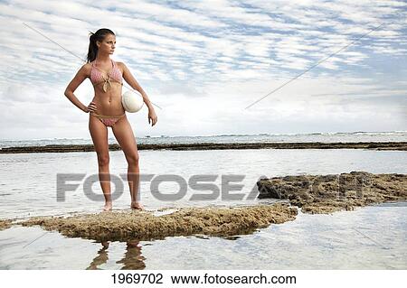 Hawaii, Oahu, Beautiful Young Female At The Beach Posing With A Volleyball. View Large Photo Image Stock Image - Hawaii, Oahu, Beautiful Young Female At The Beach Posing With A Volleyball.. Fotosearch