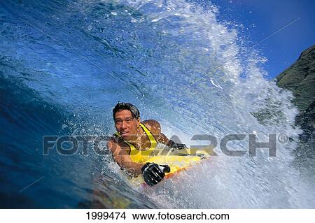 Hawaii, Oahu, Body Boarding Danny Kim Close-Up In Curling Wave View Large Photo Image Picture - Hawaii, Oahu, Body Boarding Danny Kim Close-Up In Curling Wave. Fotosearch