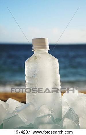 Stock Photo - Hawaii, Oahu, Bottle Of Water On The Beach.. Fotosearch