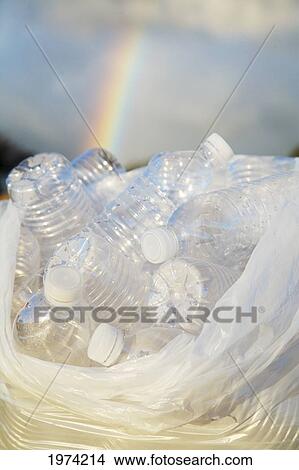 Picture - Hawaii, Oahu, Bottles Of Water In A Trash Bag On The Beach.. Fotosearch