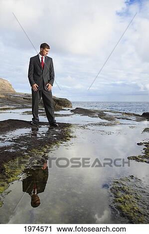 Hawaii, Oahu, Business Man In His Suit At Rocky Coastline. View Large Photo Image Stock Image - Hawaii, Oahu, Business Man In His Suit At Rocky Coastline.. Fotosearch