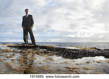 Hawaii, Oahu, Business Man In His Suit At Rocky Coastline. View Large Photo Image Stock Photography - Hawaii, Oahu, Business Man In His Suit At Rocky Coastline.. Fotosearch