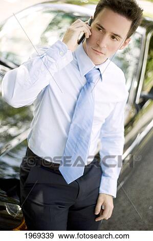 Hawaii, Oahu, Business Man Talking On Cell Phone. View Large Photo Image Stock Photo - Hawaii, Oahu, Business Man Talking On Cell Phone.. Fotosearch