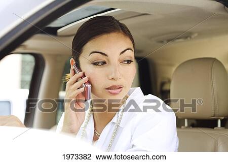 Hawaii, Oahu, Business Woman On The Phone In Her Car. View Large Photo Image Stock Image - Hawaii, Oahu, Business Woman On The Phone In Her Car.. Fotosearch