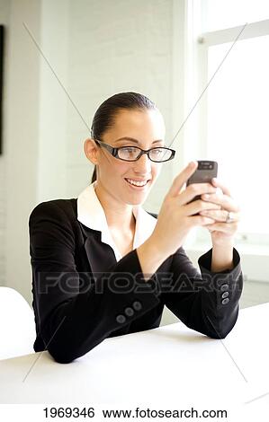 Stock Photograph - Hawaii, Oahu, Business Woman With Her Cell Phone.. Fotosearch