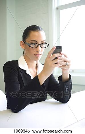 Stock Photography - Hawaii, Oahu, Business Woman With Her Cell Phone.. Fotosearch