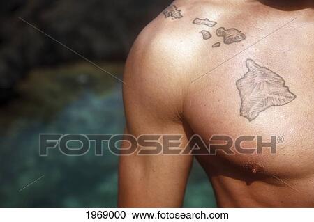 Stock Image - Hawaii, Oahu, Close Up Of Hawaiian Islands Tattoo On A Local Man's Chest.. Fotosearch