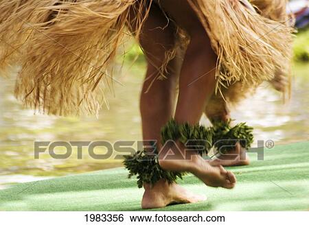Stock Photograph - Hawaii, Oahu, Close-Up Of Hula Dancer Feet With Grass Skirts.. Fotosearch