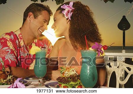 Hawaii, Oahu, Couple At A Restaurant At Sunset. View Large Photo Image Stock Image - Hawaii, Oahu, Couple At A Restaurant At Sunset.. Fotosearch