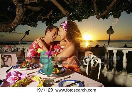 Stock Photo - Hawaii, Oahu, Couple At A Restaurant At Sunset.. Fotosearch