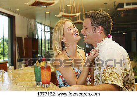 Hawaii, Oahu, Couple Having Drinks At A Bar. View Large Photo Image Stock Image - Hawaii, Oahu, Couple Having Drinks At A Bar.. Fotosearch