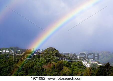 Stock Image - Hawaii, Oahu, Double Rainbow In Pacific Heights Nieghborhood. (Editorial Use Only). Fotosearch