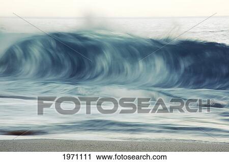 Stock Image - Hawaii, Oahu, Early Morning Waves On The North Shore.. Fotosearch