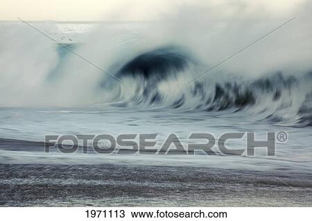 Stock Image - Hawaii, Oahu, Early Morning Waves On The North Shore.. Fotosearch