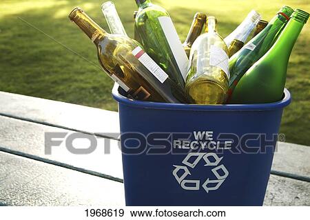 Stock Photo - Hawaii, Oahu, Empty Glass Bottles In A Recycle Trash Can. Fotosearch