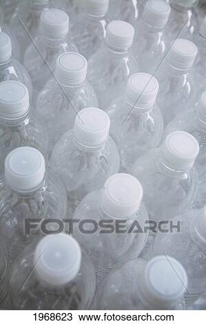 Stock Image - Hawaii, Oahu, Empty Plastic Water Bottles. Fotosearch