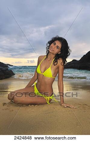 Stock Photo - Hawaii, Oahu, Eternity Beach, Beautiful girl on the beach in the morning.. Fotosearch