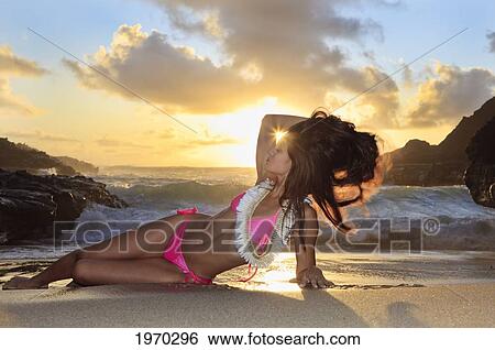 Stock Photograph - Hawaii, Oahu, Eternity Beach, Beautiful Woman Modeling On The Shore. Fotosearch