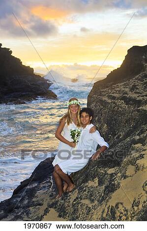 Hawaii, Oahu, Eternity Beach, Portrait Of A Newlywed Couple View Large Photo Image Stock Photo - Hawaii, Oahu, Eternity Beach, Portrait Of A Newlywed Couple. Fotosearch