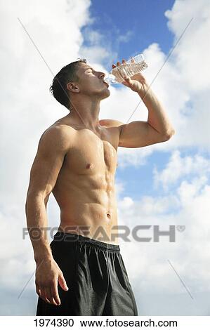 Hawaii, Oahu, Fit Male Drinking Water At The Tidepool. View Large Photo Image Stock Image - Hawaii, Oahu, Fit Male Drinking Water At The Tidepool.. Fotosearch
